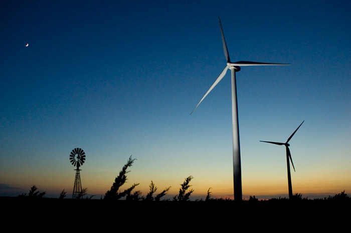 Two wind turbines at the Horse Hollow Wind Farm at dusk.